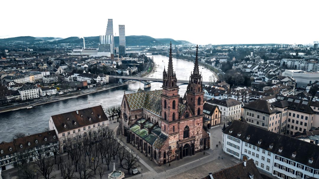 Stunning aerial view of Basel Minster, a Gothic landmark in Basel, Switzerland.