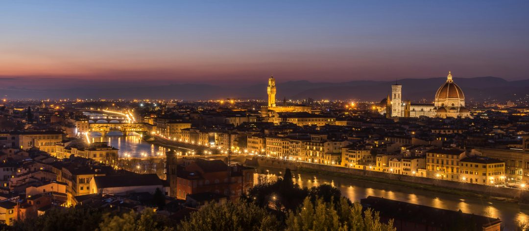 A breathtaking view of Florence's skyline during twilight with prominent landmarks beautifully lit.